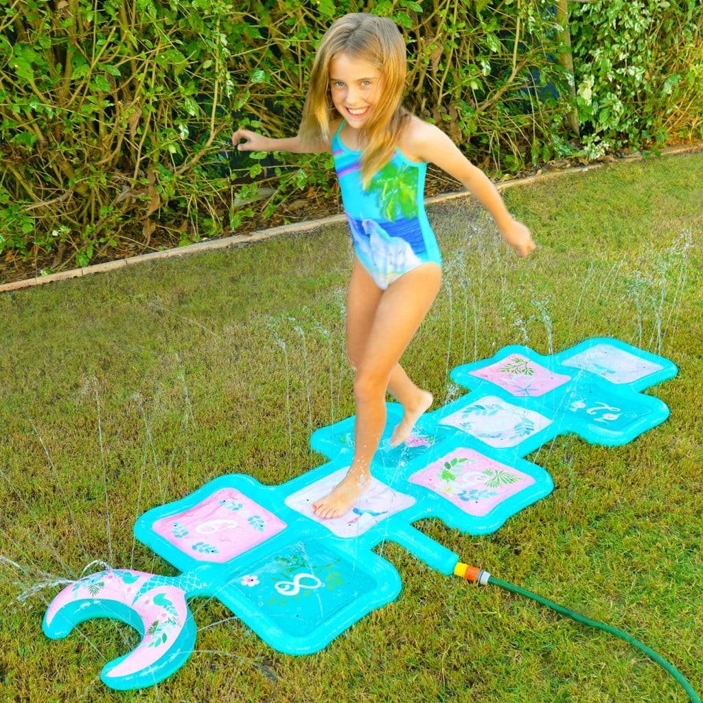 Child in backyard playing with the Wahu Mermaid Hop &#39;N Splash
